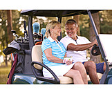   Golfen, Golfmobil, Seniorenpaar